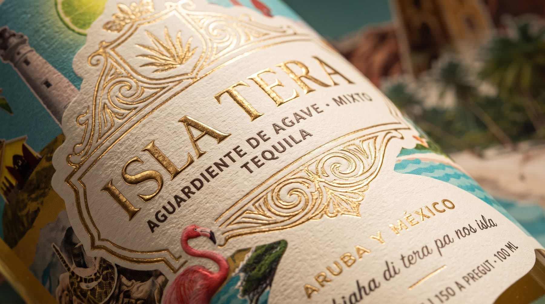 Extreme macro detail of the Isla Tera label showing the collage artwork, gold foil and tactile emboss
