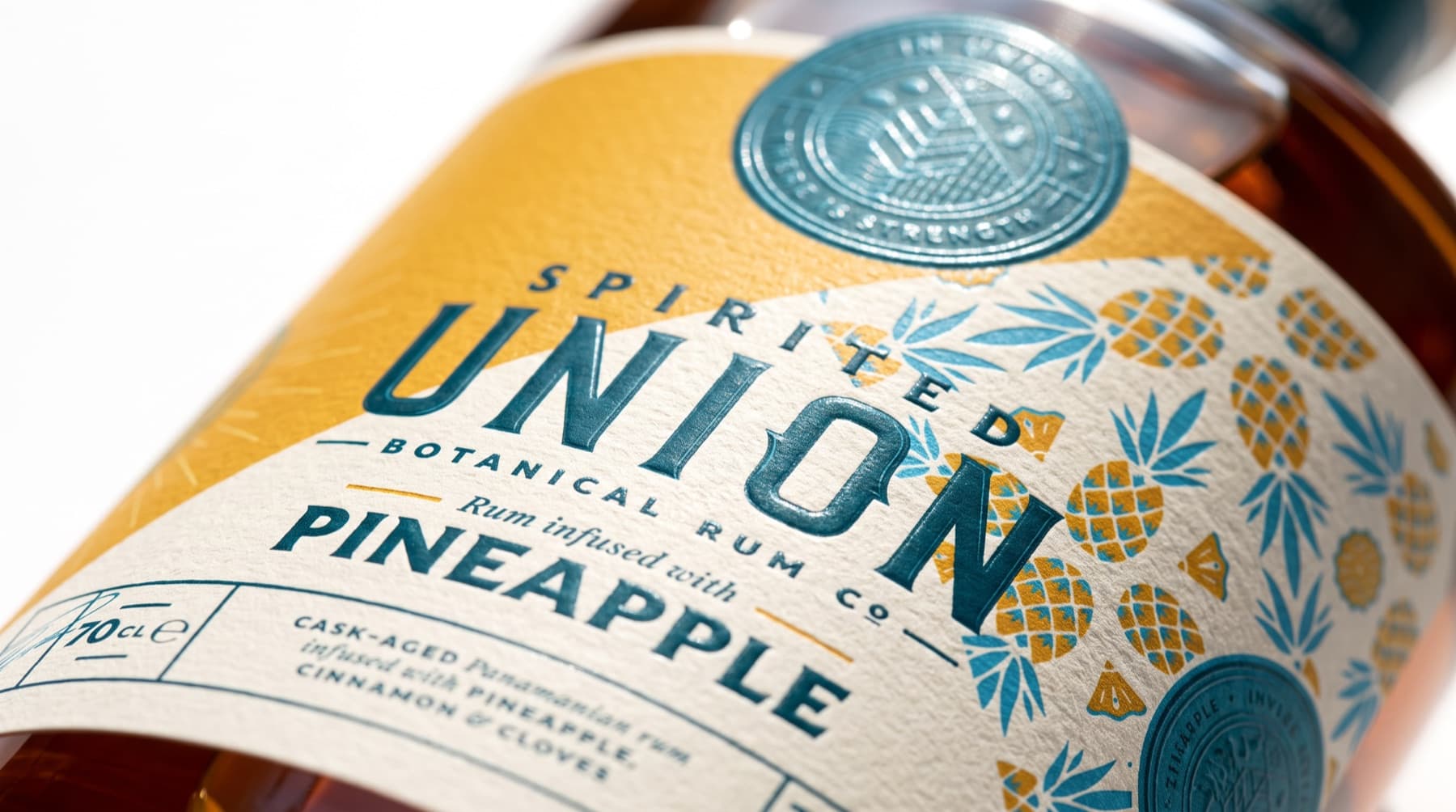 Close-up of the Spirited Union pineapple rum label with embossed seal