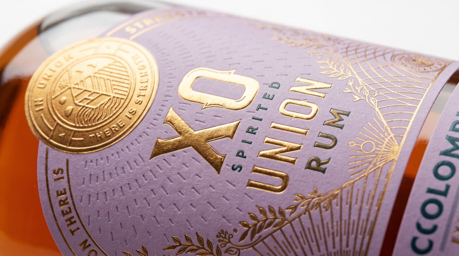 Close-up of the Spirited Union XO rum Colombia label with gold foil seal